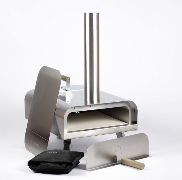 photo du four avec sa pelle et une housse de protection